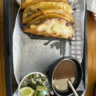 Quesabirrias Platillo. Difficult to eat, but satisfying. Minced red onion and cilantro on the side.