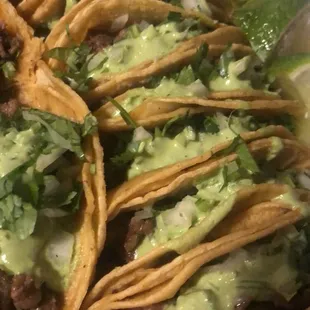 Steak tacos with their guacamole salsa, onions and cilantro. Served with lime and hot or mild sauce.