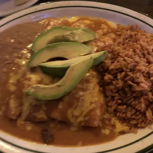 Fajita enchiladas, topped with avocados