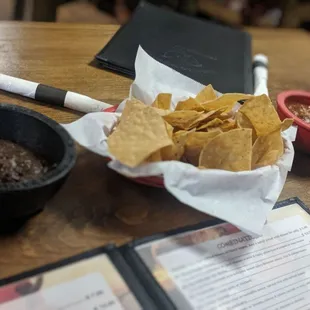 Complimentary chips, salsa, and refried black beans