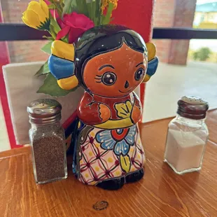 One of the little figurines that was on each of the tables