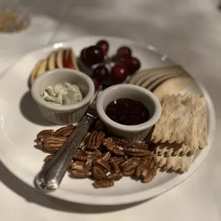 Complimentary cheese and fruit plate with fig compote