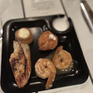 Appetizers: goat cheese balls, shrimp, crab cake ball, bread