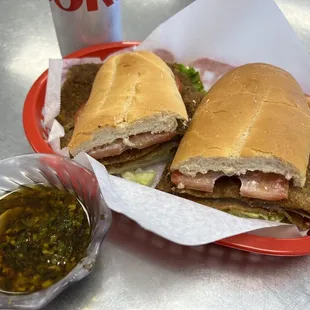 Milanesa Sandwich - lightly breaded meat with thin sliced tomato and lettuce.
