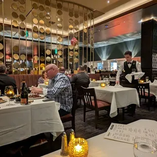 a restaurant with people sitting at tables