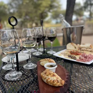 a plate of food and wine glasses