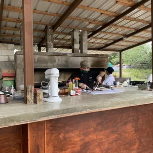 Sit on the deck and watch the master cook up all the food while looking out at the beautiful hillside!