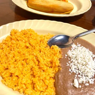 Red pork tamales with rice and beans