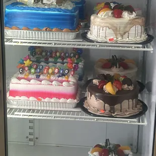 a refrigerator full of cakes