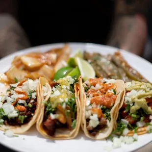 Tacos: asada, pastor, chorizo, Chicken pastor, Chicken tinga, lengua, tripa, veggie fajitas and soy chorizo.