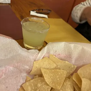a plate of chips and a drink