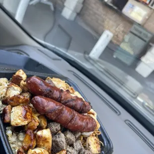 Rice and noodles at the bottom with chicken, beef, and shrimp.. added 2 hotlinks for an additional charge