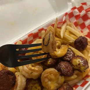 Fries with sausage and shrimp