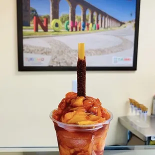 a dessert in a plastic cup