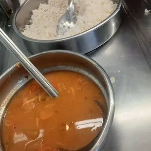 a bowl of soup and a bowl of rice