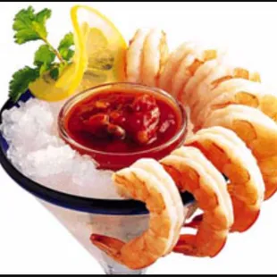a cocktail with shrimp and ice