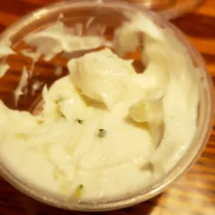 a bowl of whipped cream and a glass of wine