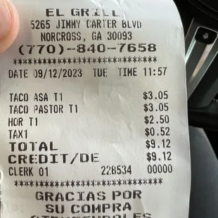 a person holding a receipt in their hand