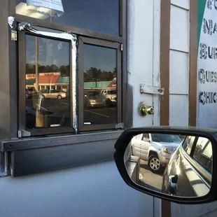 the reflection of a car in a mirror