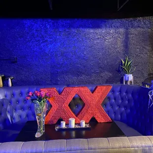 a table with flowers and candles on it