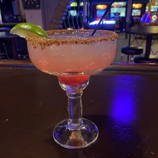 a margarita sitting on a bar