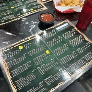 a table with menus and drinks