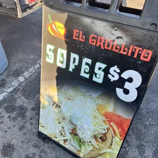 a sign for a taco truck