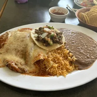 Combo plate with a chile relleno, chicken enchilada, and carne asada taco