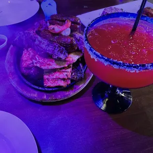 Pariillada and strawberry margarita