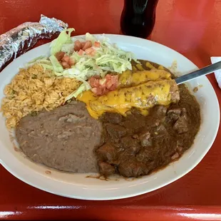 Texas Plate: 12.99  Two chicken enchiladas, carne guisada, rice and beans with a Mexican coke ($3.00)