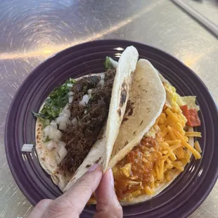 Barbacoa and chiliqueles taco