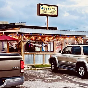two trucks parked in front of a restaurant