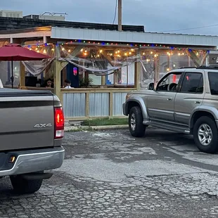 two trucks parked in front of a restaurant