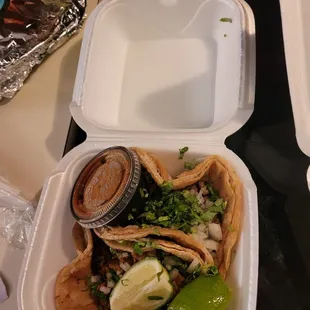 One Al pastor taco and one steak taco