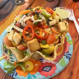 Chicken taco salad with marinated chicken, rich flavors and a southwest dressing. Yum!