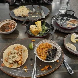 Shrimp tacos, Steak Burrito, Elote, empty Queso!