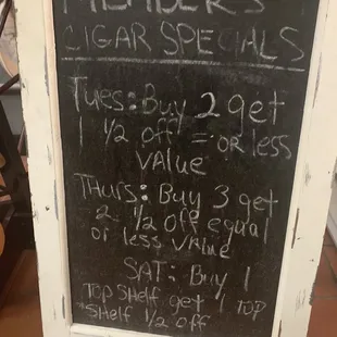 a chalkboard with a price list