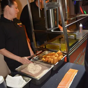 a man and a woman at a buffet