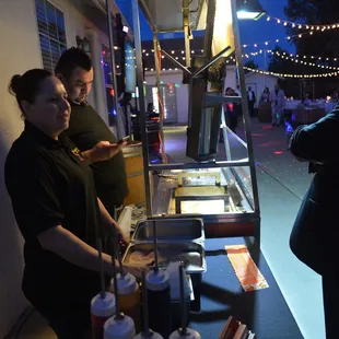 a man and a woman preparing food