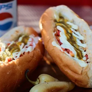 Our Sonoran hot dogs include beans, grilled &amp; fresh onion, tomato, mayo, mustard &amp; jalapeno sauce.