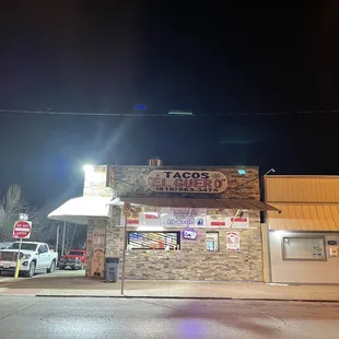 the outside of a restaurant at night