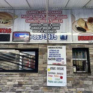 a sign on the side of a restaurant