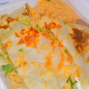 three quesadillas in a styrofoam container