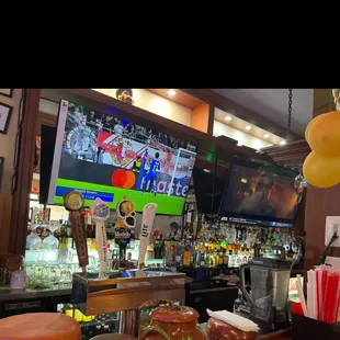 a bar with a television in the background