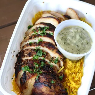 Chicken Chermoula w/ Rice ($16 large) - chicken breast, herby green sauce w/ preserved lemon and olive oil, saffron rice