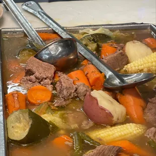 a bowl of beef and vegetable soup