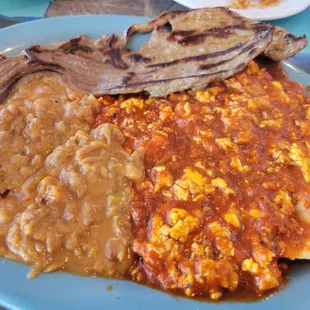 Huasteca enchiladas plate with cecina steak