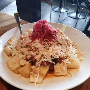 Yuca w/ chicharrones, cabbage and pickled red onion topping. Enormous plate!