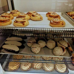 a variety of pastries in a display case