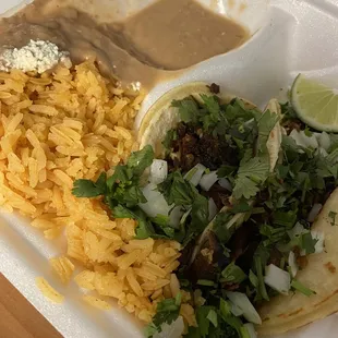 Carnitas tacos with beans and rice. Beans got a little wonky on the drive back.